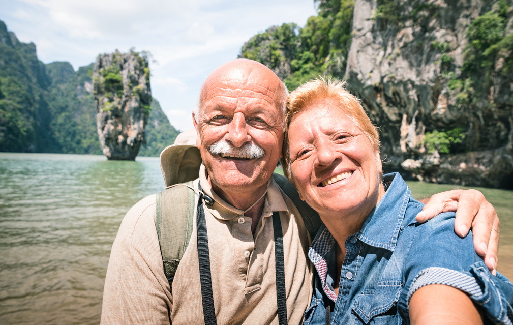 Happy Retired Senior Couple Taking Travel Selfie around World